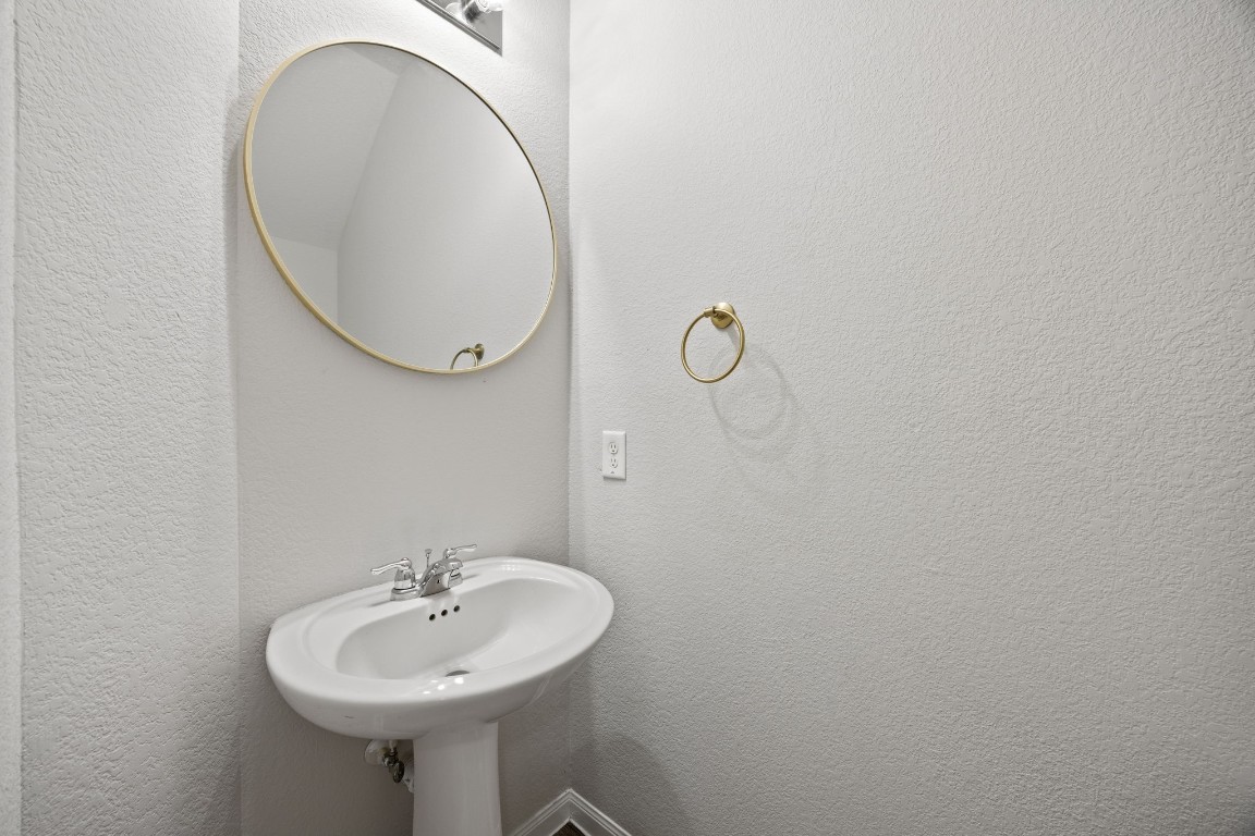 18606 Lansdowne Stream Path Katy, TX 77449 - Photo 27 of 39 First-floor half bathroom conveniently located for guests.