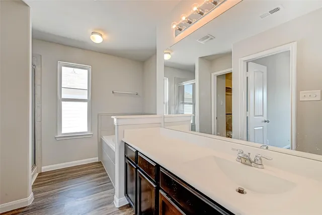 a white bath tub sitting next to a window
