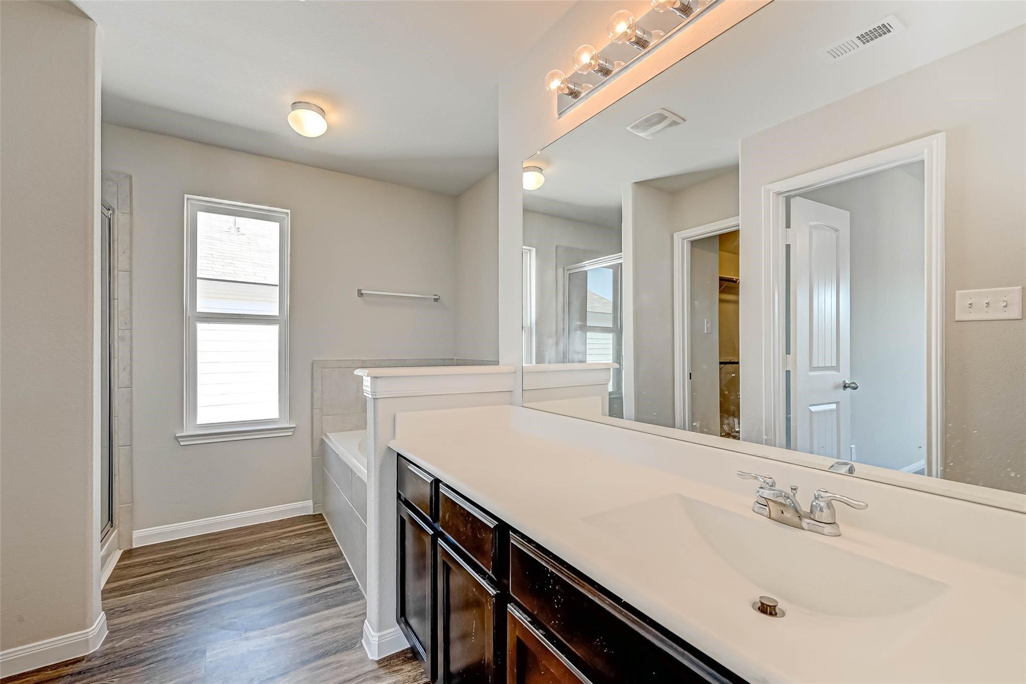 18606 Lansdowne Stream Path Katy, TX 77449 - Photo 29 of 39 a bathroom with a sink a vanity and a mirror