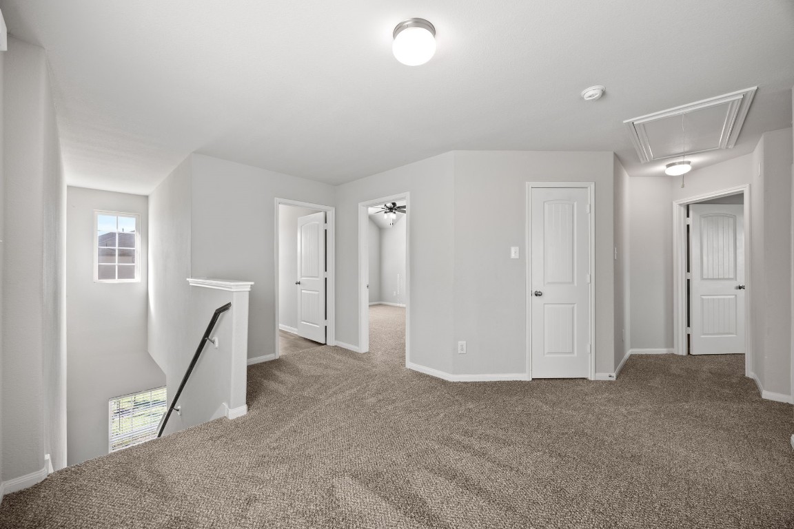 18606 Lansdowne Stream Path Katy, TX 77449 - Photo 30 of 39 Bedrooms branch off from the upstairs gameroom, creating a functional and connected layout.