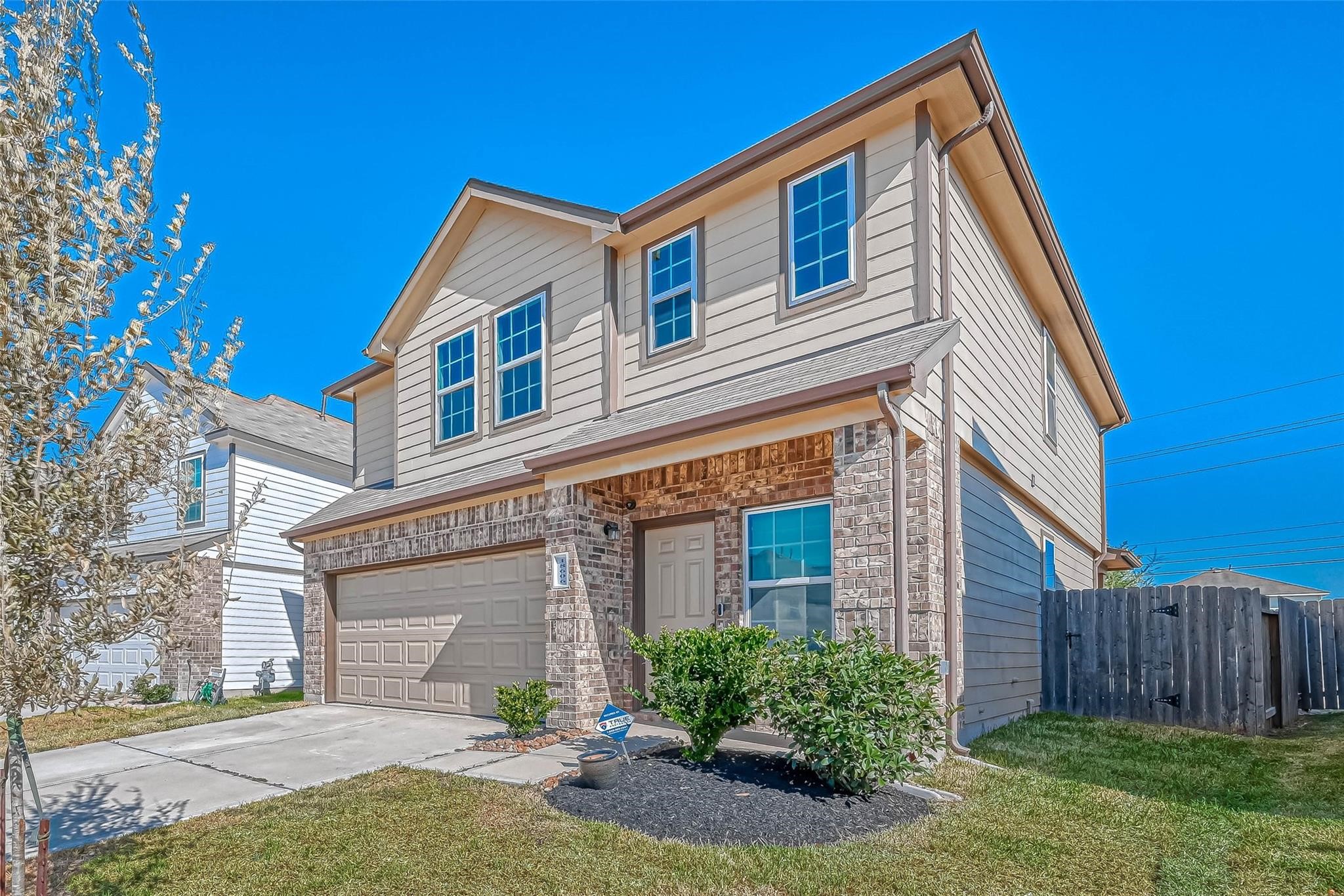 18606 Lansdowne Stream Path Katy, TX 77449 - Photo 3 of 39 a front view of a house with garden