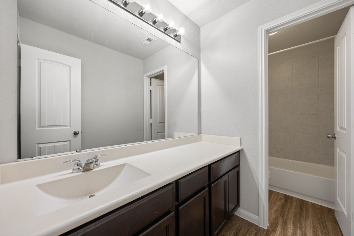 18606 Lansdowne Stream Path Katy, TX 77449 - Photo 33 of 39 Primary bathroom has a long counter, separate shower, and toilet.