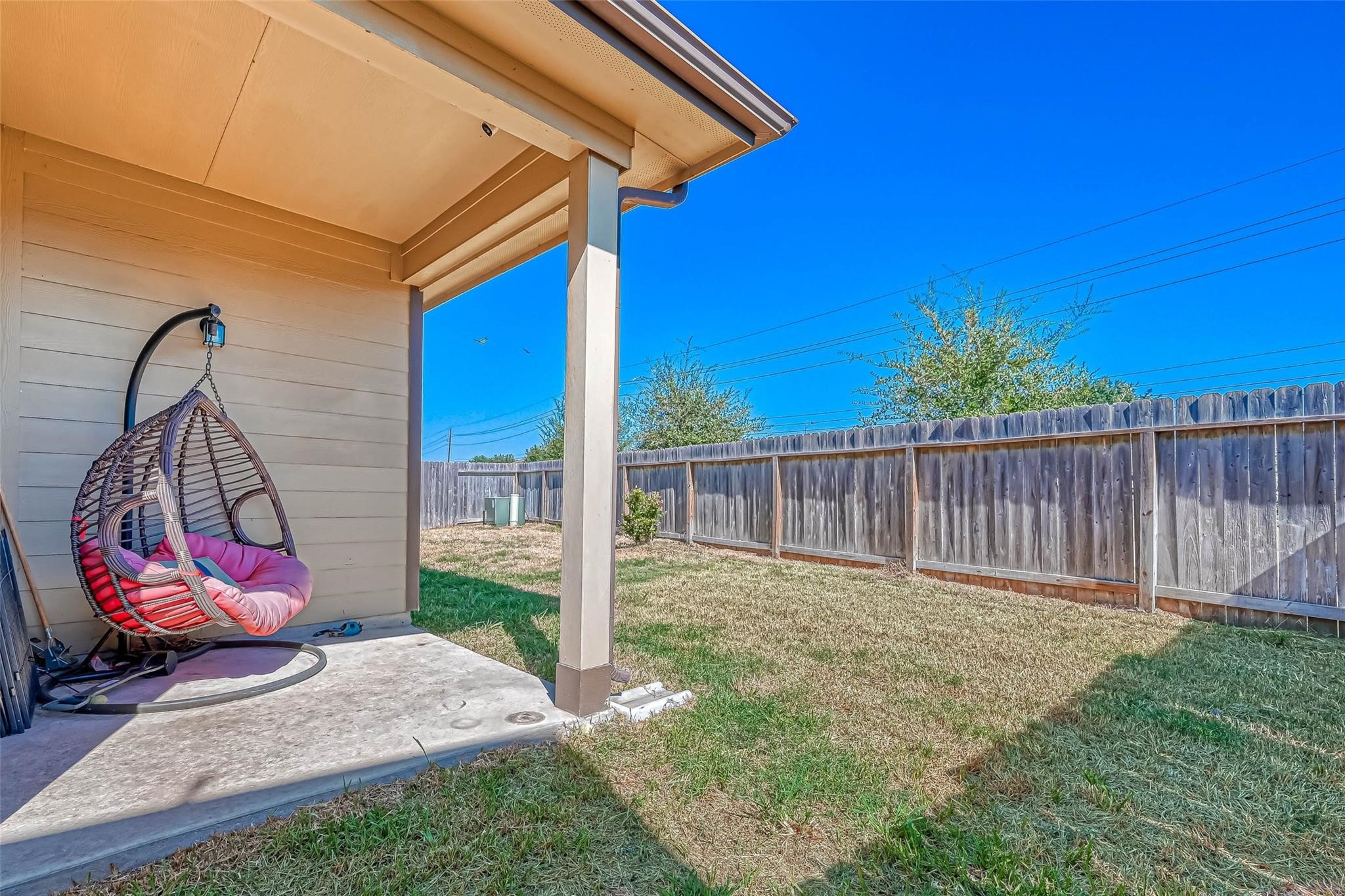 18606 Lansdowne Stream Path Katy, TX 77449 - Photo 36 of 39 a view of a backyard with a slide