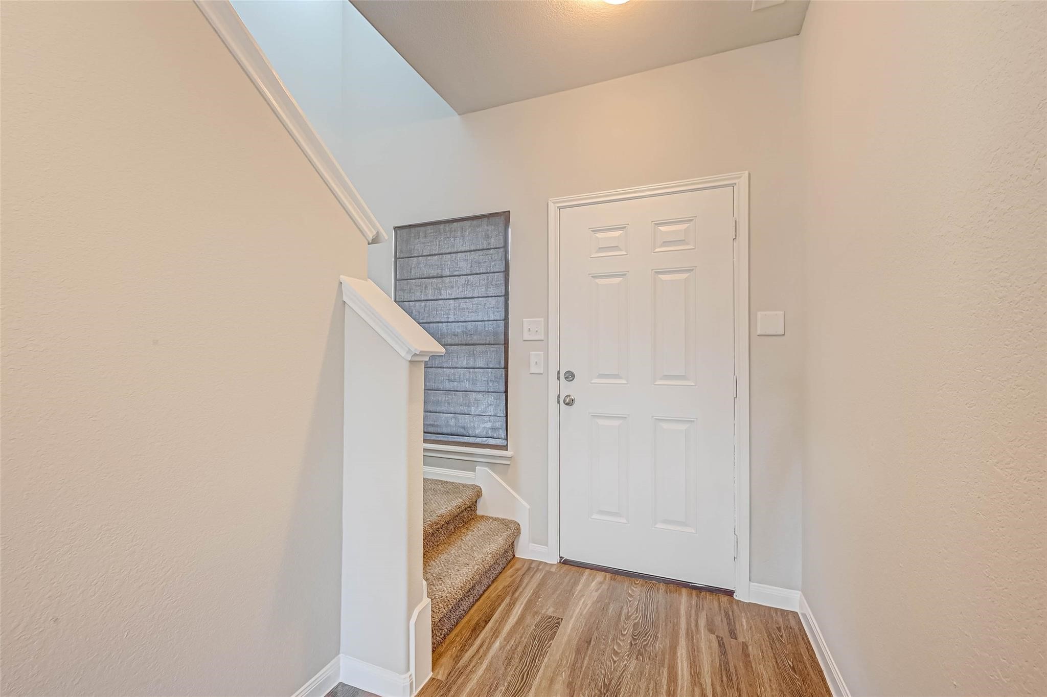 18606 Lansdowne Stream Path Katy, TX 77449 - Photo 5 of 39 a view of a hallway with wooden floor and entryway