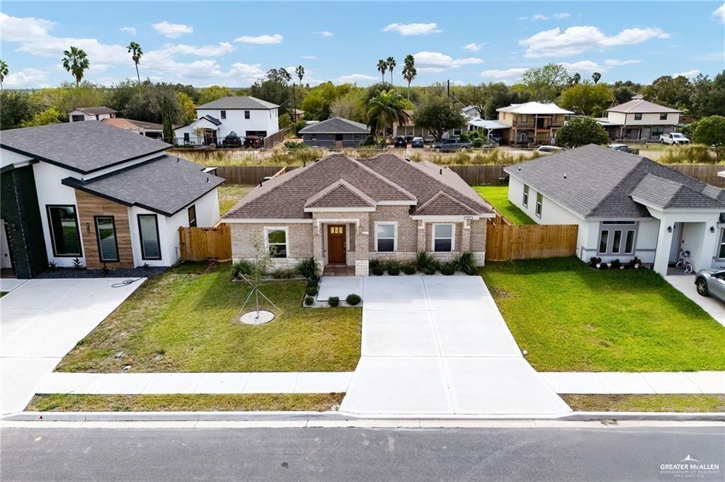 2110 Trinity Street Donna, TX 78537 - Photo 16 of 17 a front view of a house with a yard table and chairs