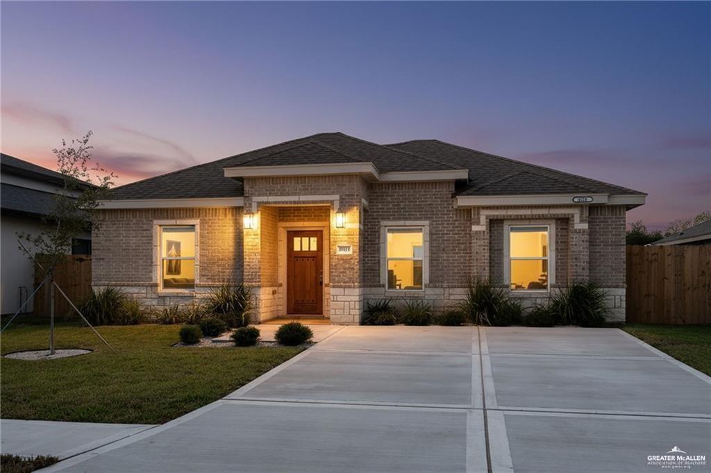 2110 Trinity Street Donna, TX 78537 - Photo 2 of 17 a front view of a house with garden