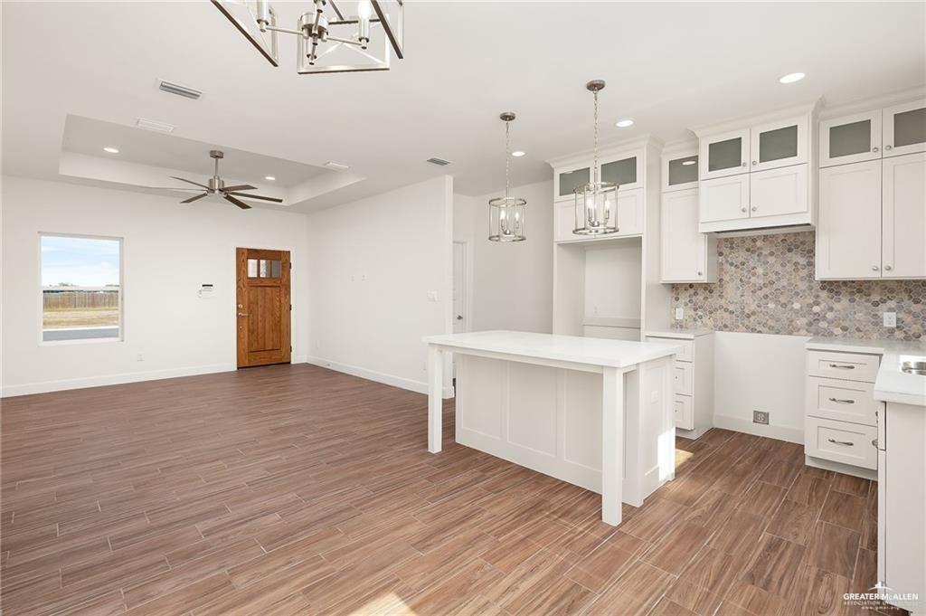 2110 Trinity Street Donna, TX 78537 - Photo 4 of 17 a kitchen with stainless steel appliances cabinets and wooden floor