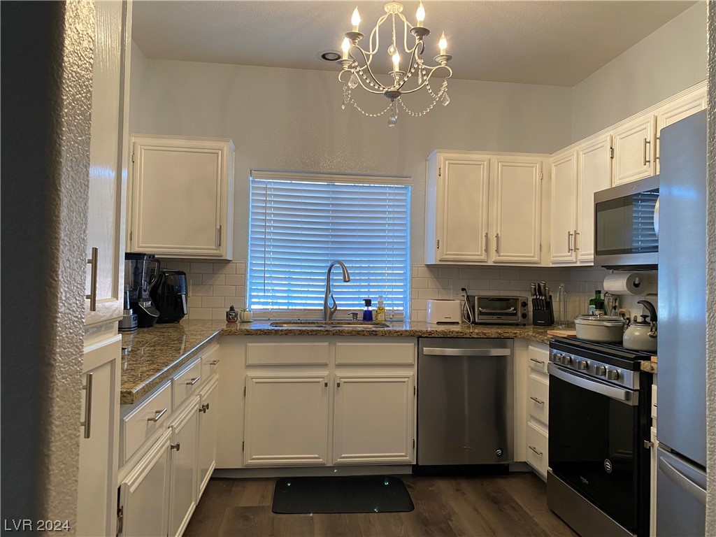 1851 Hillpointe Road, Unit 2522 Henderson, NV 89074 - Photo 2 of 8 UPGRADED KITCHEN WITH WHITE CABINETS, SS APPLIANCE