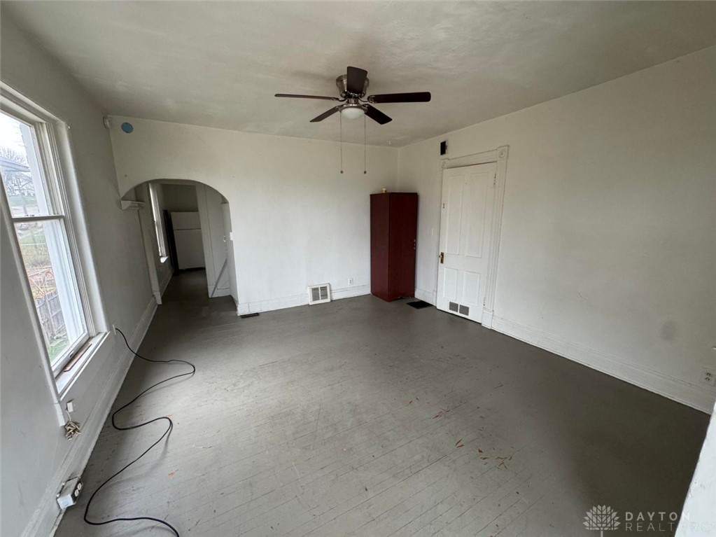 707 West High Street Springfield, OH 45506 - Photo 4 of 4 This bright room features durable hardwood floors and an inviting arched doorway leading to another area.