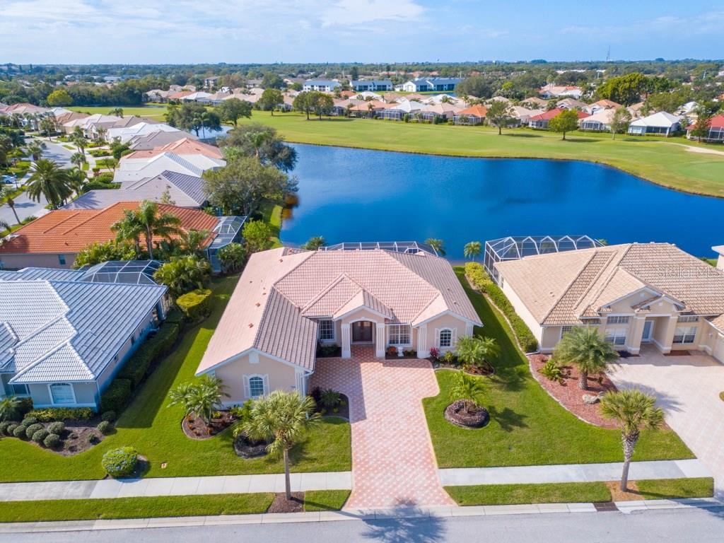 709 Sawgrass Bridge Road Venice, FL 34292 - Photo 1 of 1 Unbelievable long lake views to golf in distance.