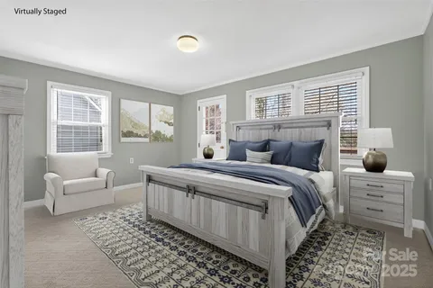 a bedroom with a large bed and a window