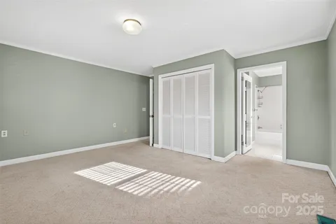 a view of wooden floor and windows in a room