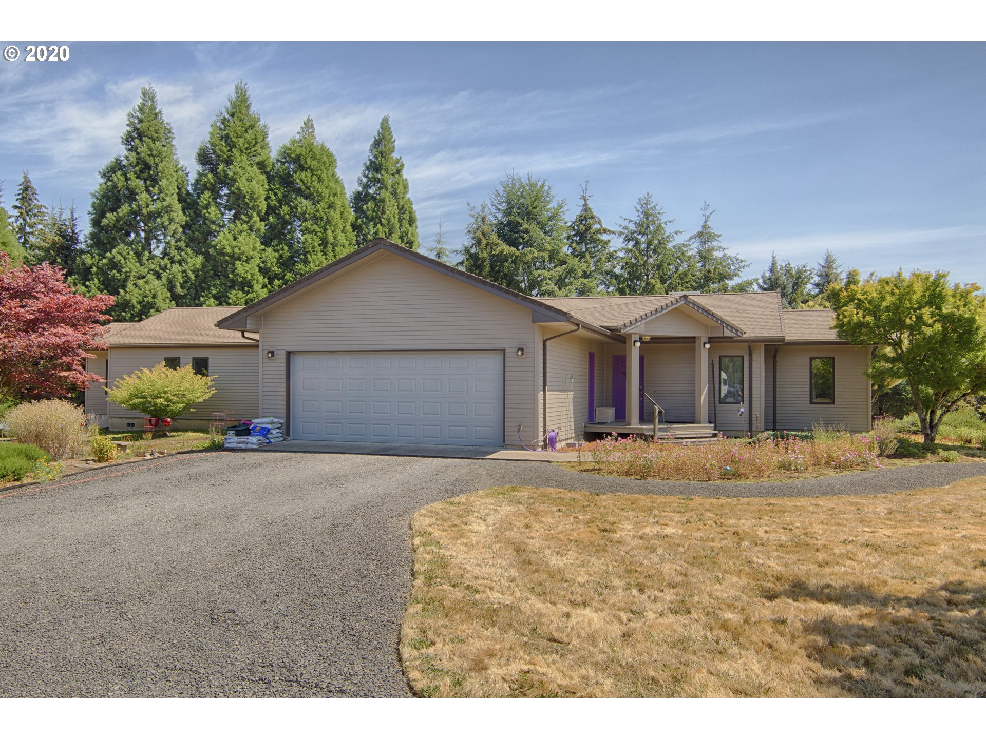 6315 Southeast Whiteson Road Amity, OR 97101 - Photo 1 of 30 a front view of a house with a yard and garage