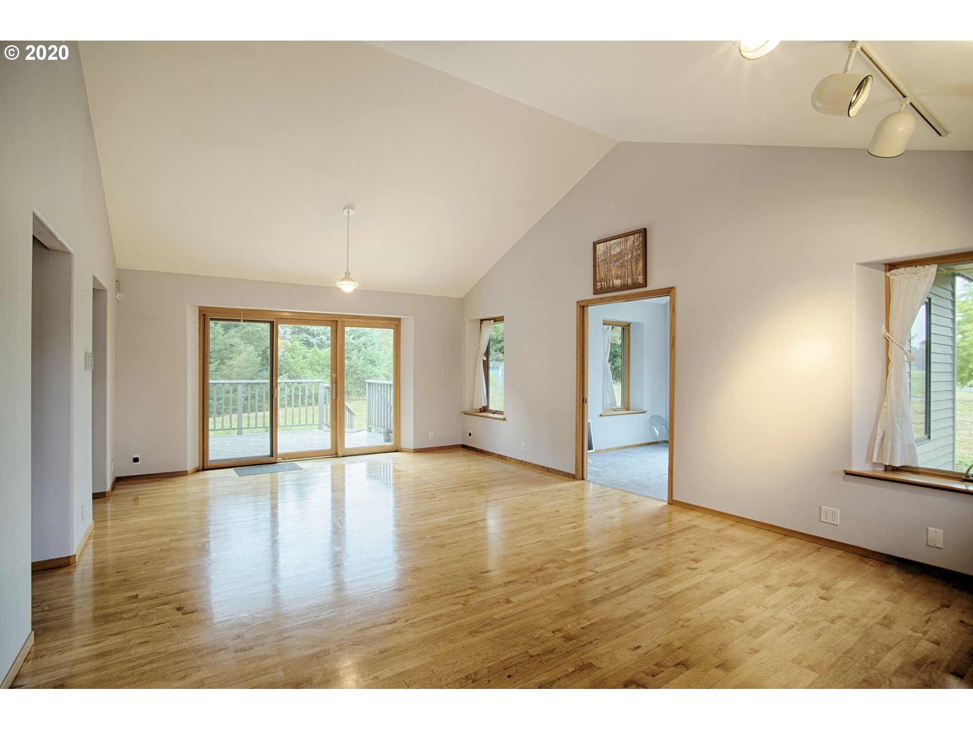 6315 Southeast Whiteson Road Amity, OR 97101 - Photo 2 of 30 a view of an empty room with window and wooden floor