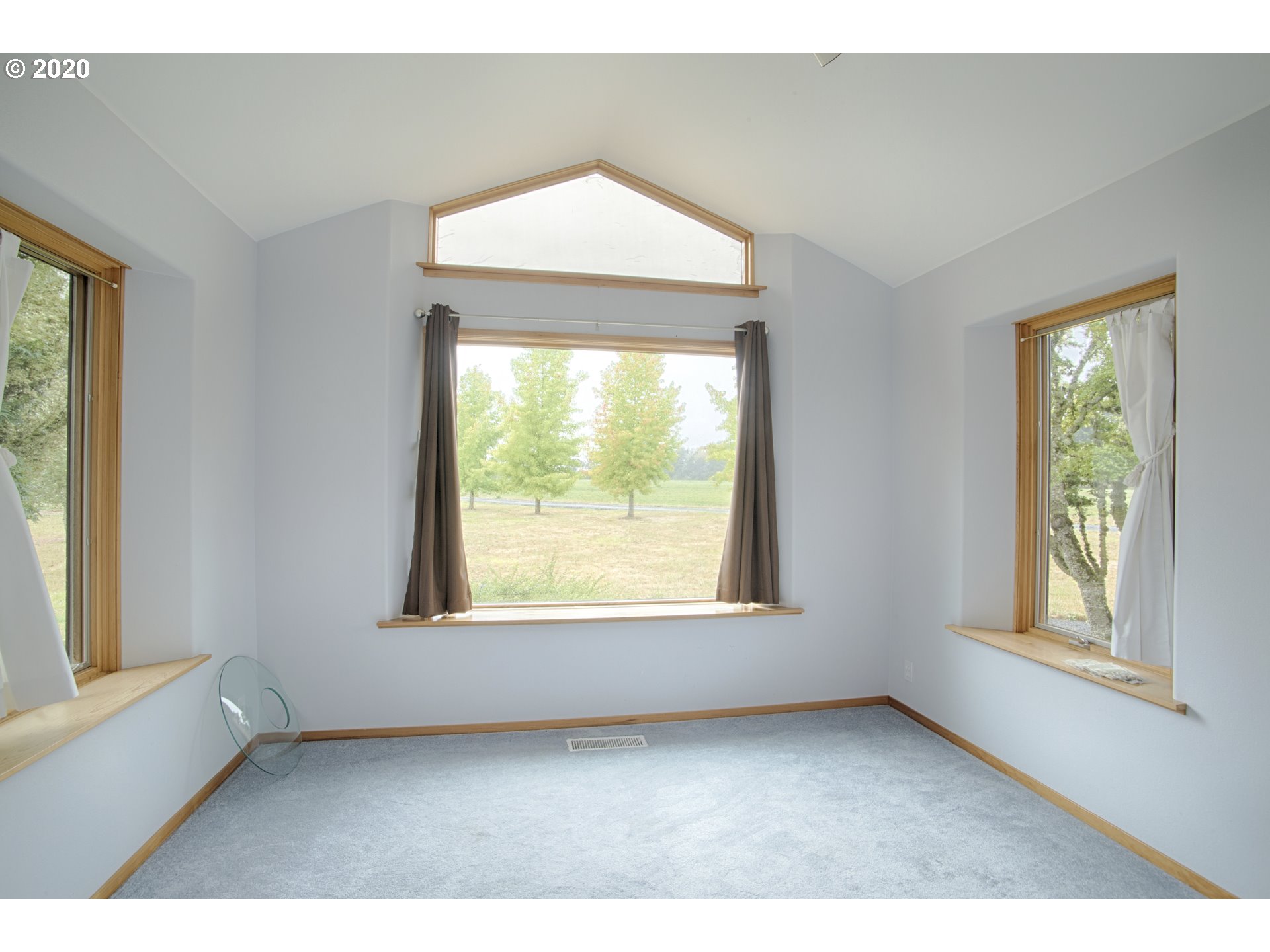 6315 Southeast Whiteson Road Amity, OR 97101 - Photo 4 of 30 a big room with windows and a chandelier