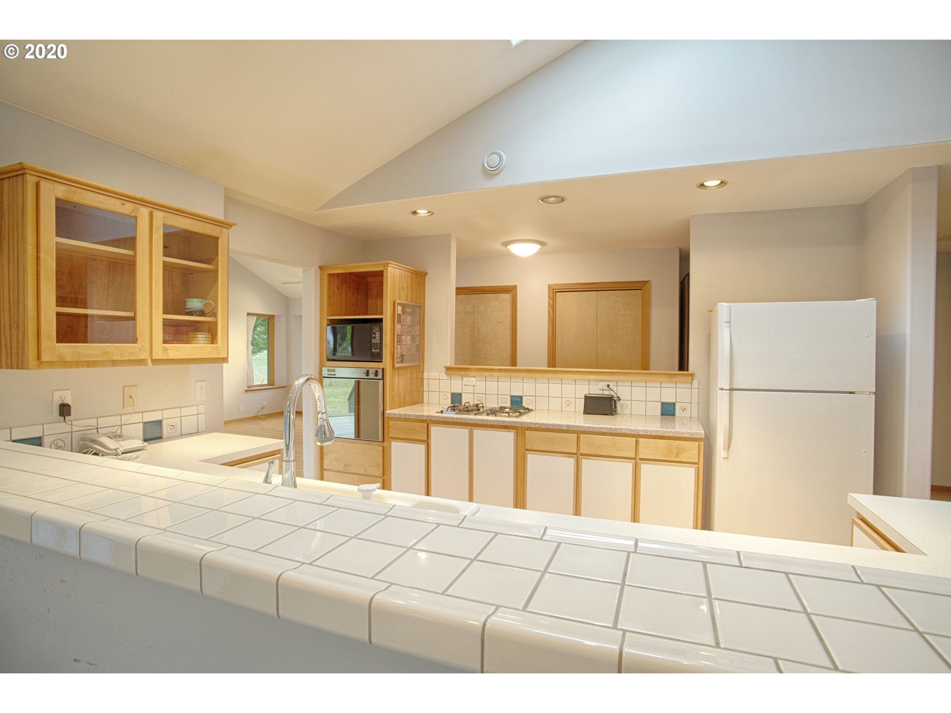 6315 Southeast Whiteson Road Amity, OR 97101 - Photo 5 of 30 a large white kitchen with granite countertop a sink and cabinets