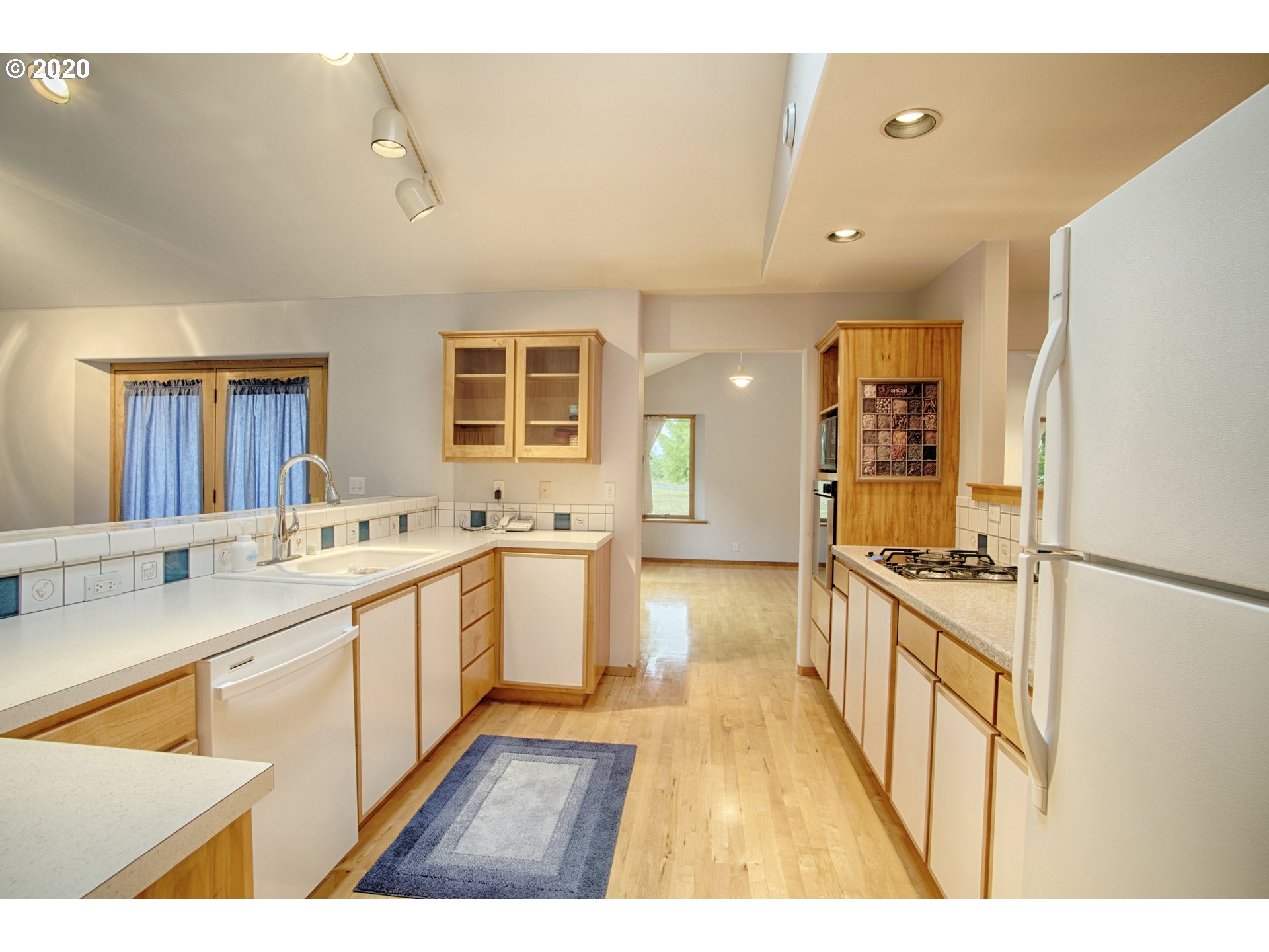 6315 Southeast Whiteson Road Amity, OR 97101 - Photo 6 of 30 a open kitchen with stainless steel appliances granite countertop a sink and cabinets