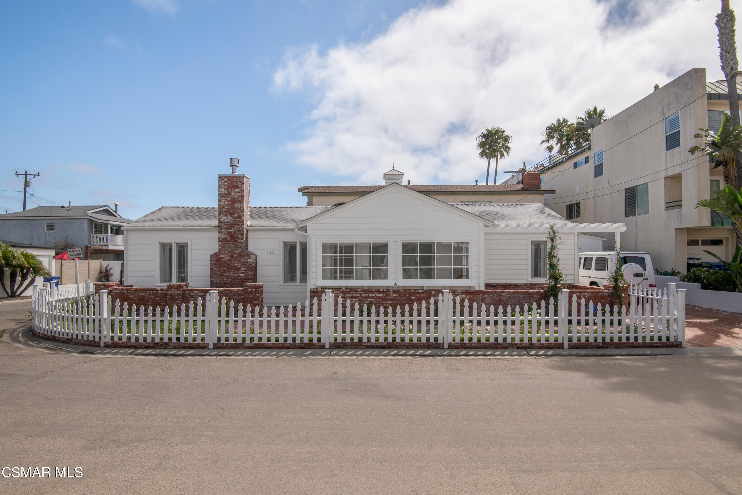 132 Santa Rosa Avenue Oxnard, CA 93035 - Photo 22 of 28 a view of a white house in front of a house