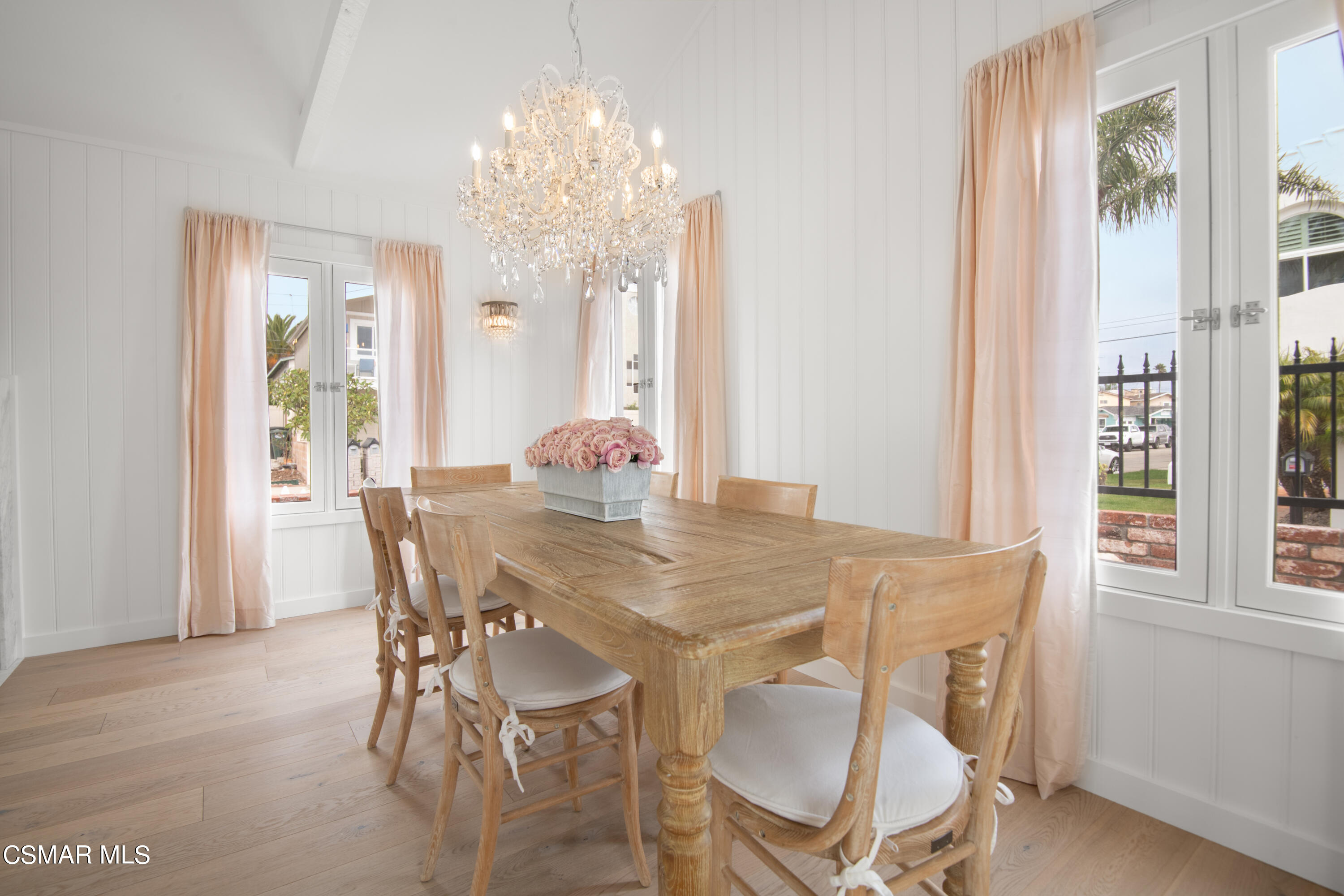 132 Santa Rosa Avenue Oxnard, CA 93035 - Photo 8 of 28 a view of a dining room with furniture and chandelier
