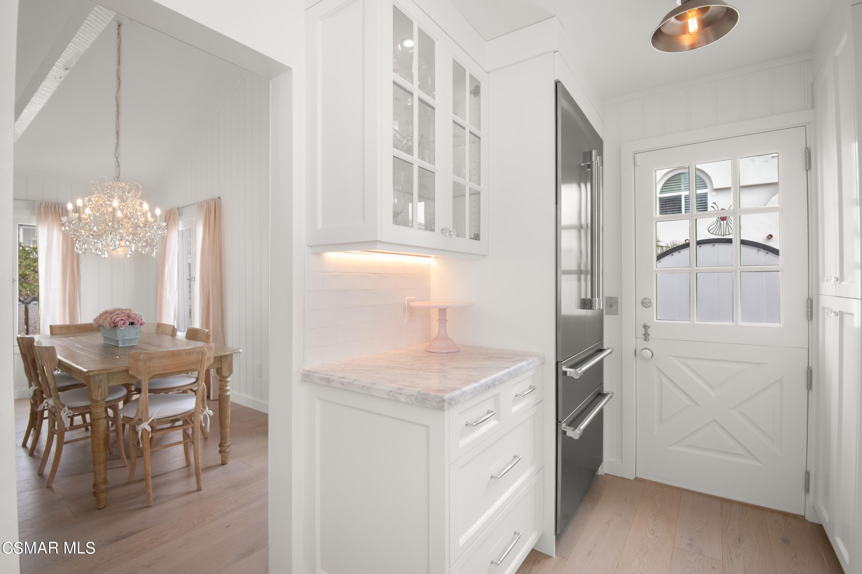 132 Santa Rosa Avenue Oxnard, CA 93035 - Photo 9 of 28 a kitchen that has a lot of cabinets in it