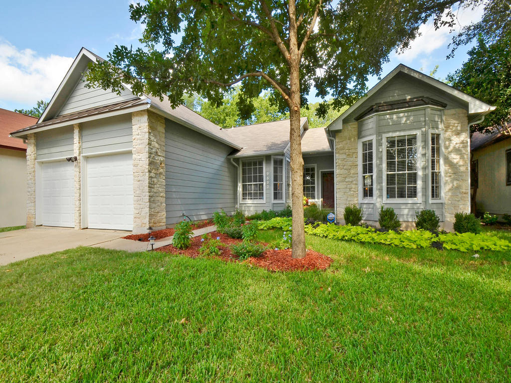 9502 Roxanna Drive Austin, TX 78748 - Photo 1 of 1 a front view of a house with a yard and porch