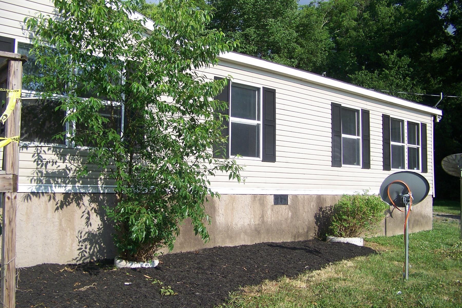 568 Farm Loop Road New Market, TN 37820 - Photo 1 of 13 a front view of a house with garden