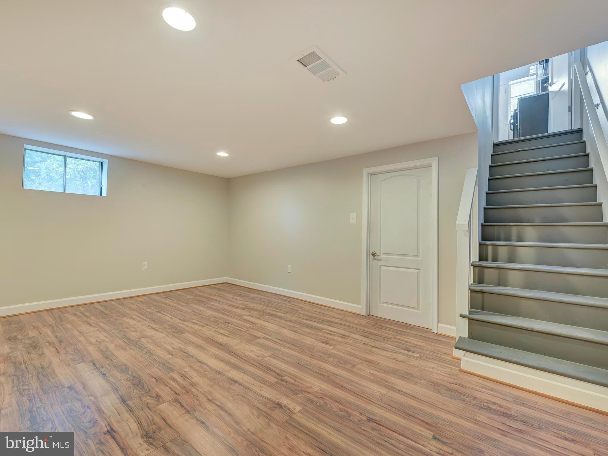 3031 Medway Street Silver Spring, MD 20902 - Photo 23 of 30 Laminate Flooring and recessed lighting