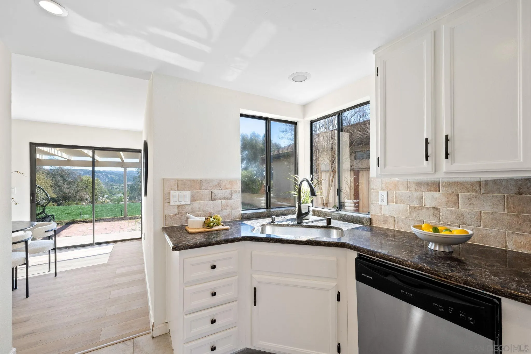 1436 Timber Escondido, CA 92027 - Photo 13 of 44 a kitchen with a sink and cabinets
