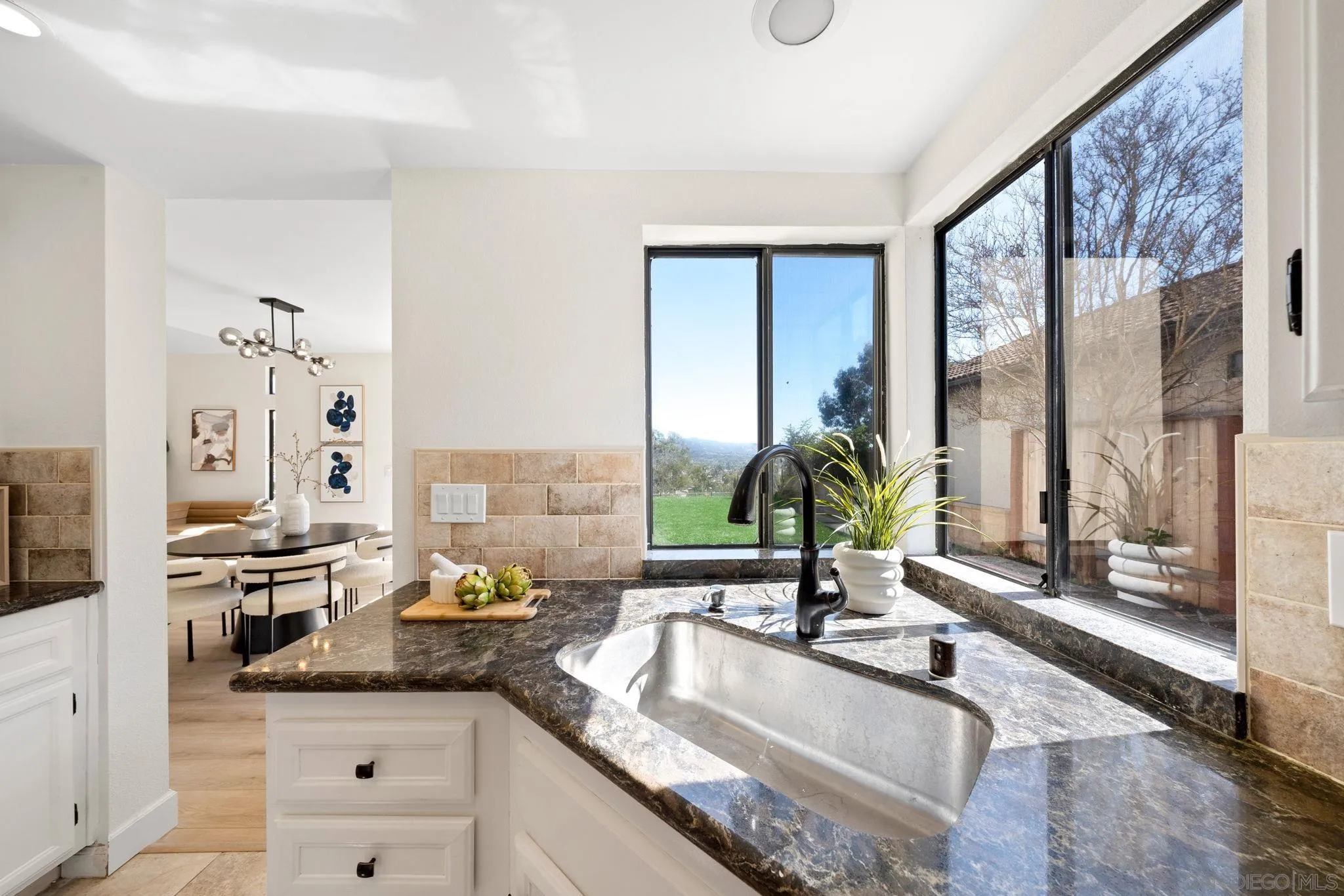 1436 Timber Escondido, CA 92027 - Photo 17 of 44 a kitchen with granite countertop a sink and a counter top space