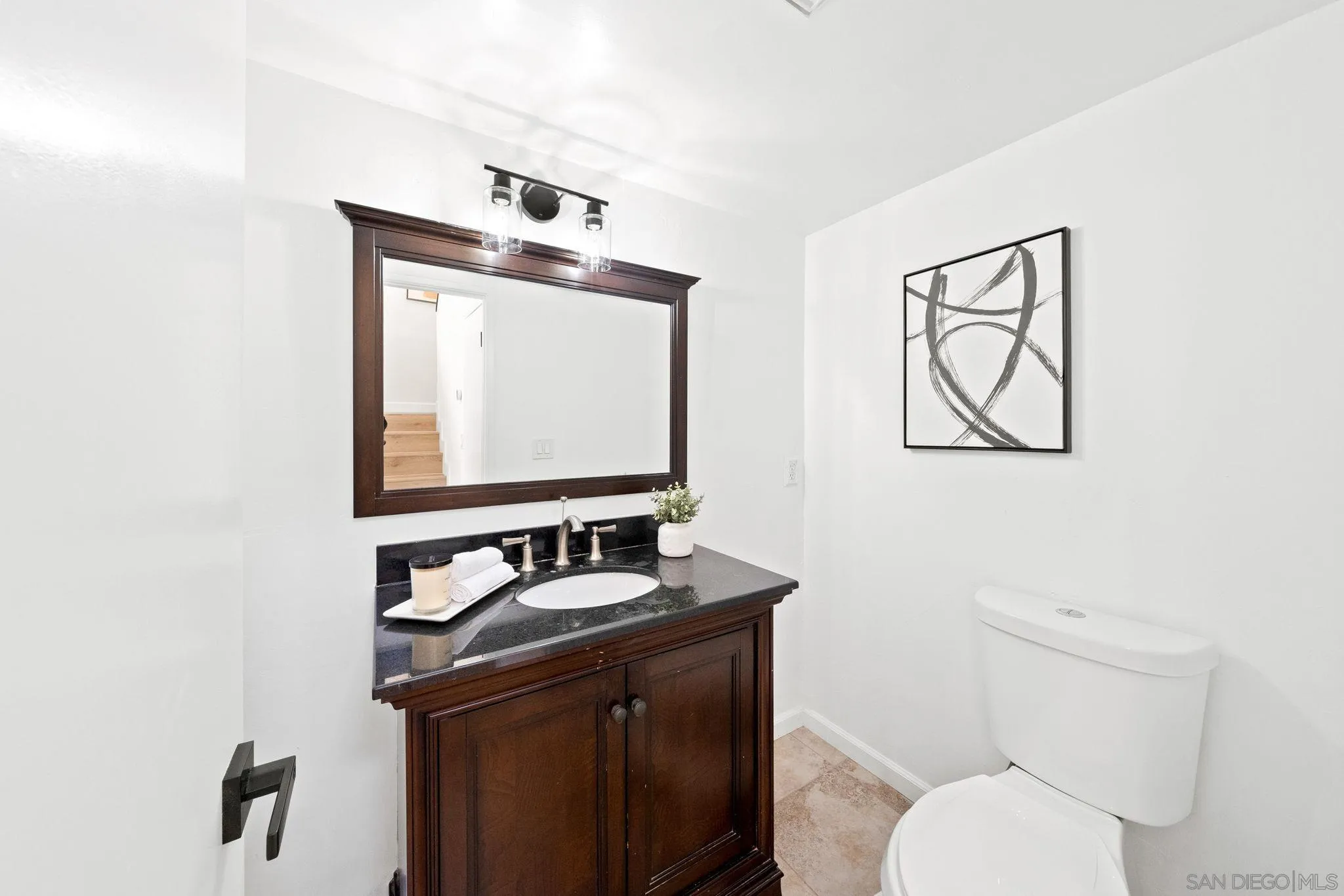 1436 Timber Escondido, CA 92027 - Photo 19 of 44 a bathroom with a toilet sink and mirror