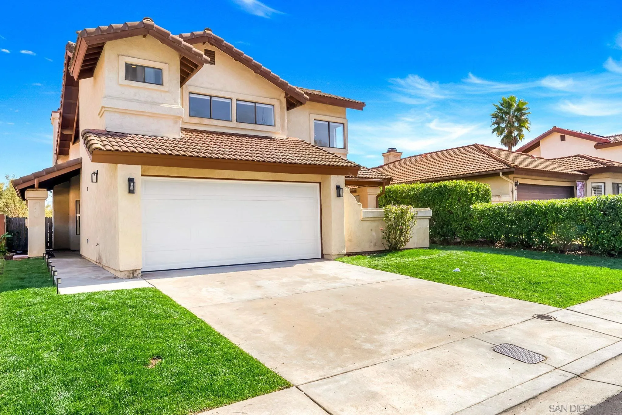 1436 Timber Escondido, CA 92027 - Photo 2 of 44 a front view of a house with a yard and garage