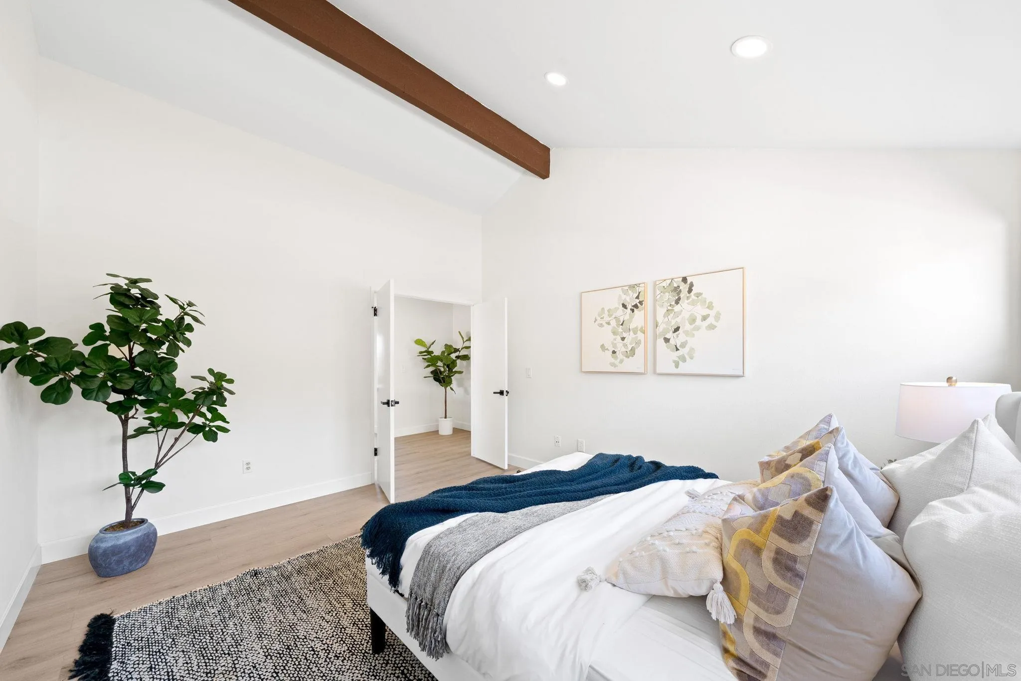 1436 Timber Escondido, CA 92027 - Photo 22 of 44 a bedroom with a bed and a potted plant