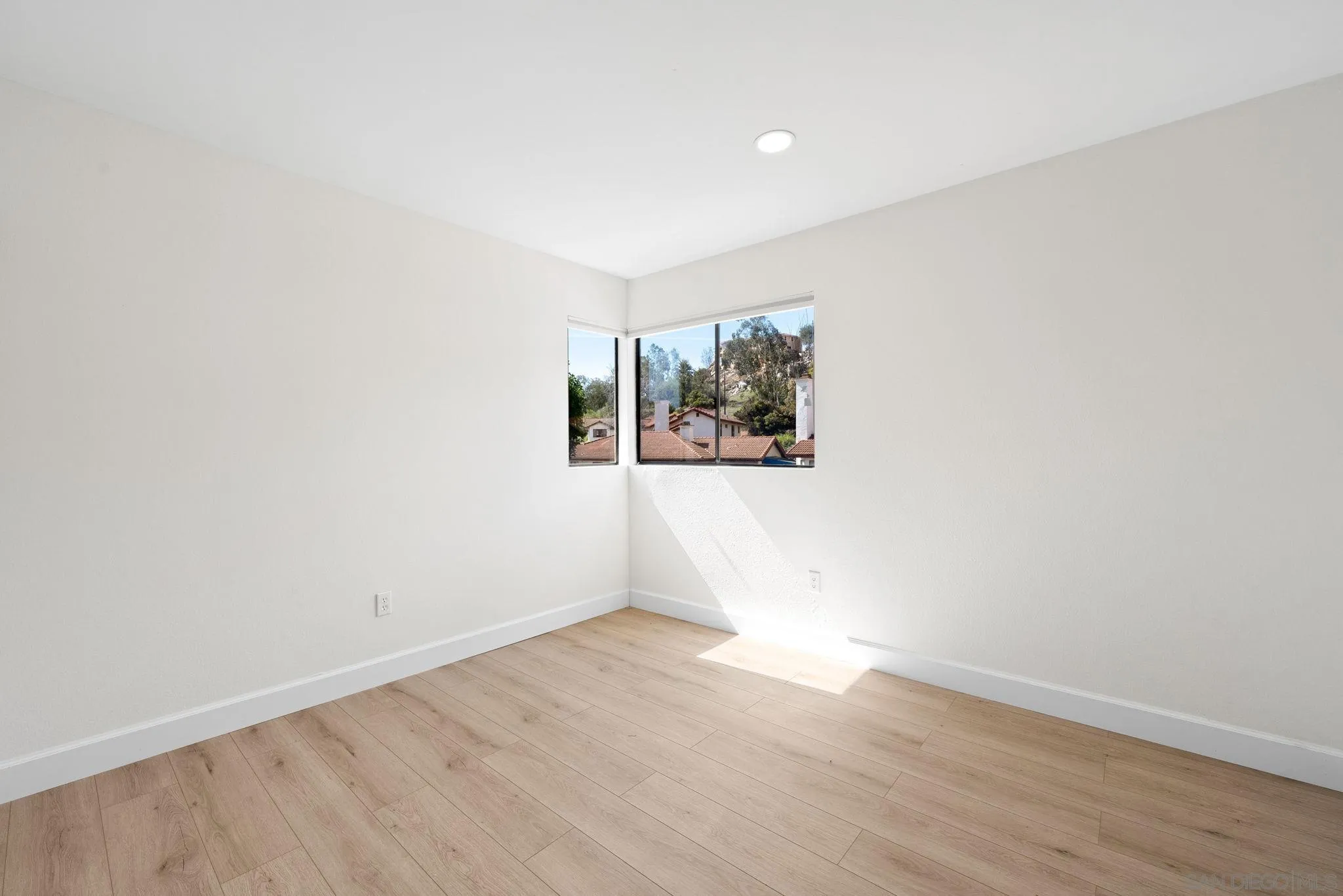 1436 Timber Escondido, CA 92027 - Photo 28 of 44 an empty room with wooden floor and window