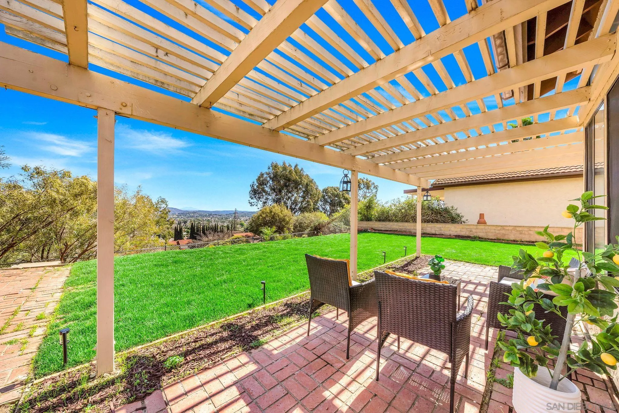 1436 Timber Escondido, CA 92027 - Photo 37 of 44 a view of a patio with a table and chairs under an umbrella