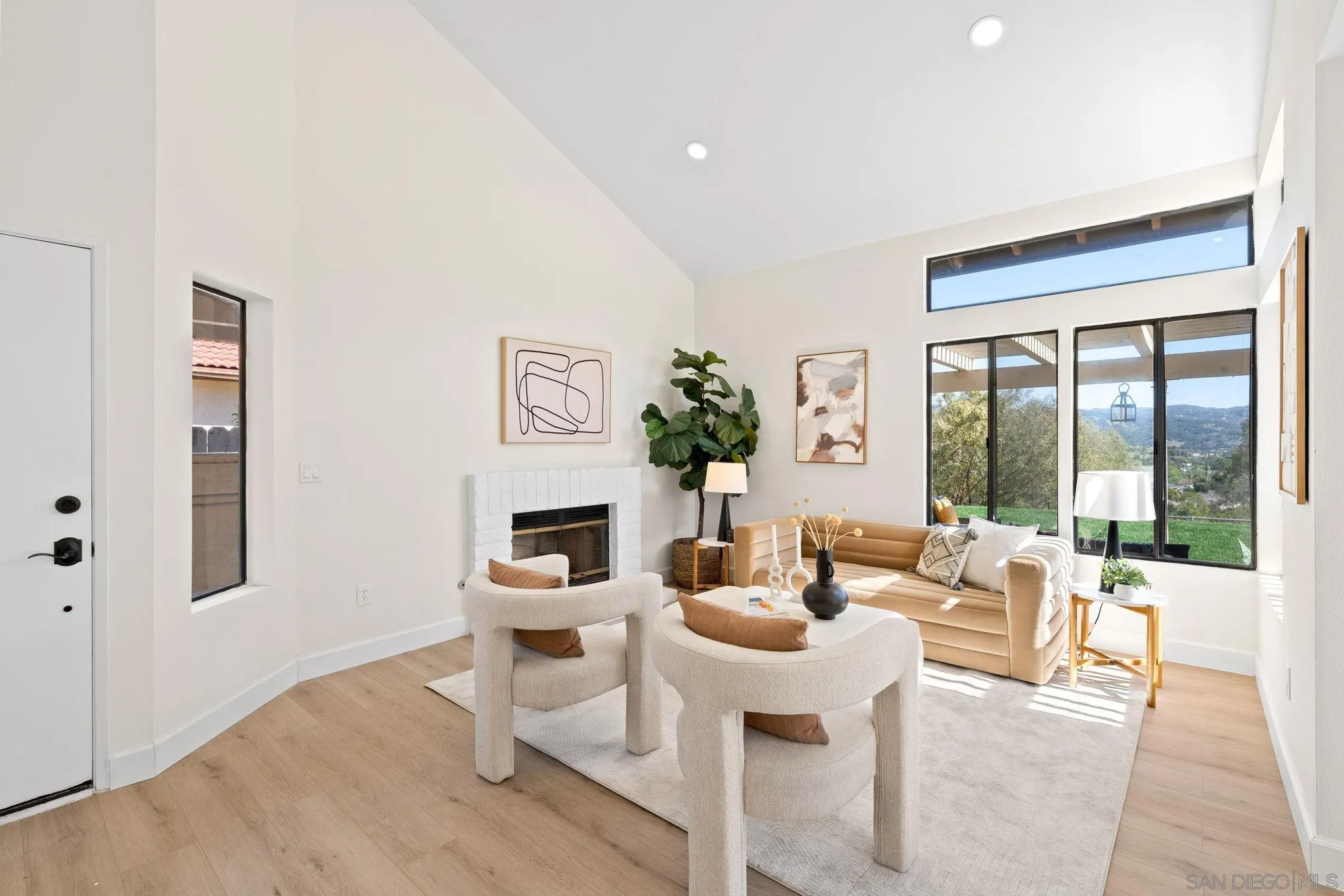1436 Timber Escondido, CA 92027 - Photo 6 of 44 a living room with furniture a fireplace and a floor to ceiling window