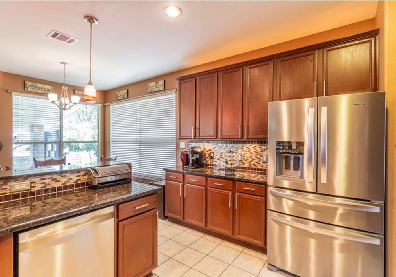 1100 Antelope Ridge Cedar Park, TX 78613 - Photo 7 of 24 a kitchen with stainless steel appliances granite countertop a refrigerator and a sink