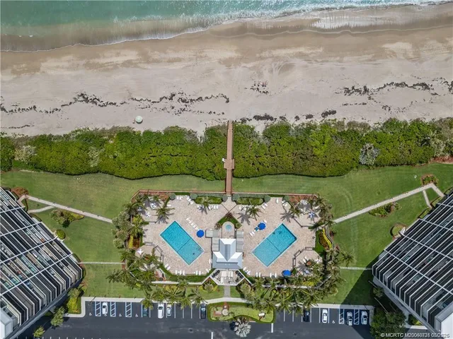 a front view of a house with a lake view