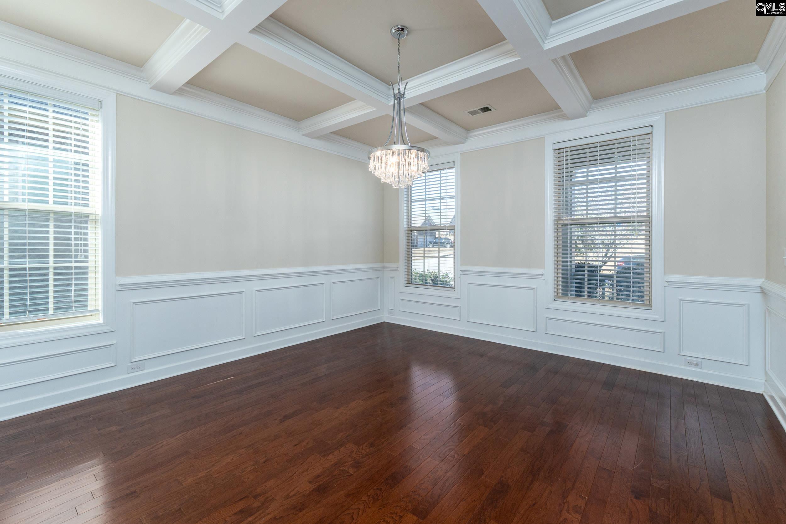 40 Wading Bird Loop Blythewood, SC 29016 - Photo 3 of 26 an empty room with wooden floor chandelier and windows