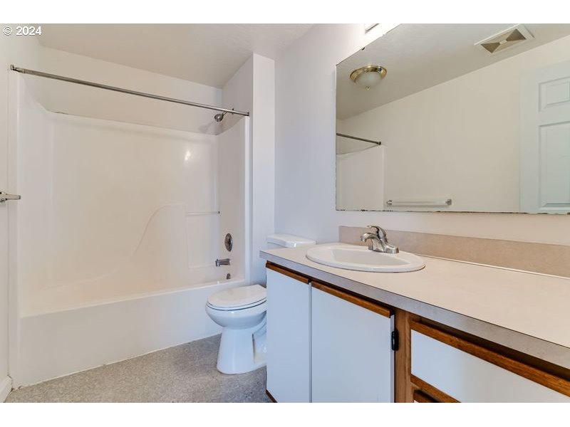 249 South 41st Place Springfield, OR 97478 - Photo 13 of 17 a bathroom with a sink a toilet and shower