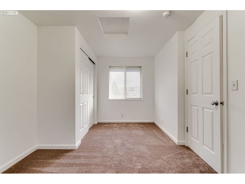 249 South 41st Place Springfield, OR 97478 - Photo 17 of 17 an empty room with wooden floor and windows