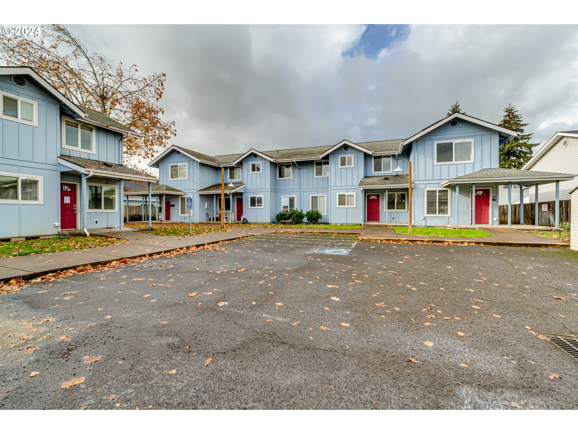 249 South 41st Place Springfield, OR 97478 - Photo 6 of 17 a front view of an apartment building with a yard