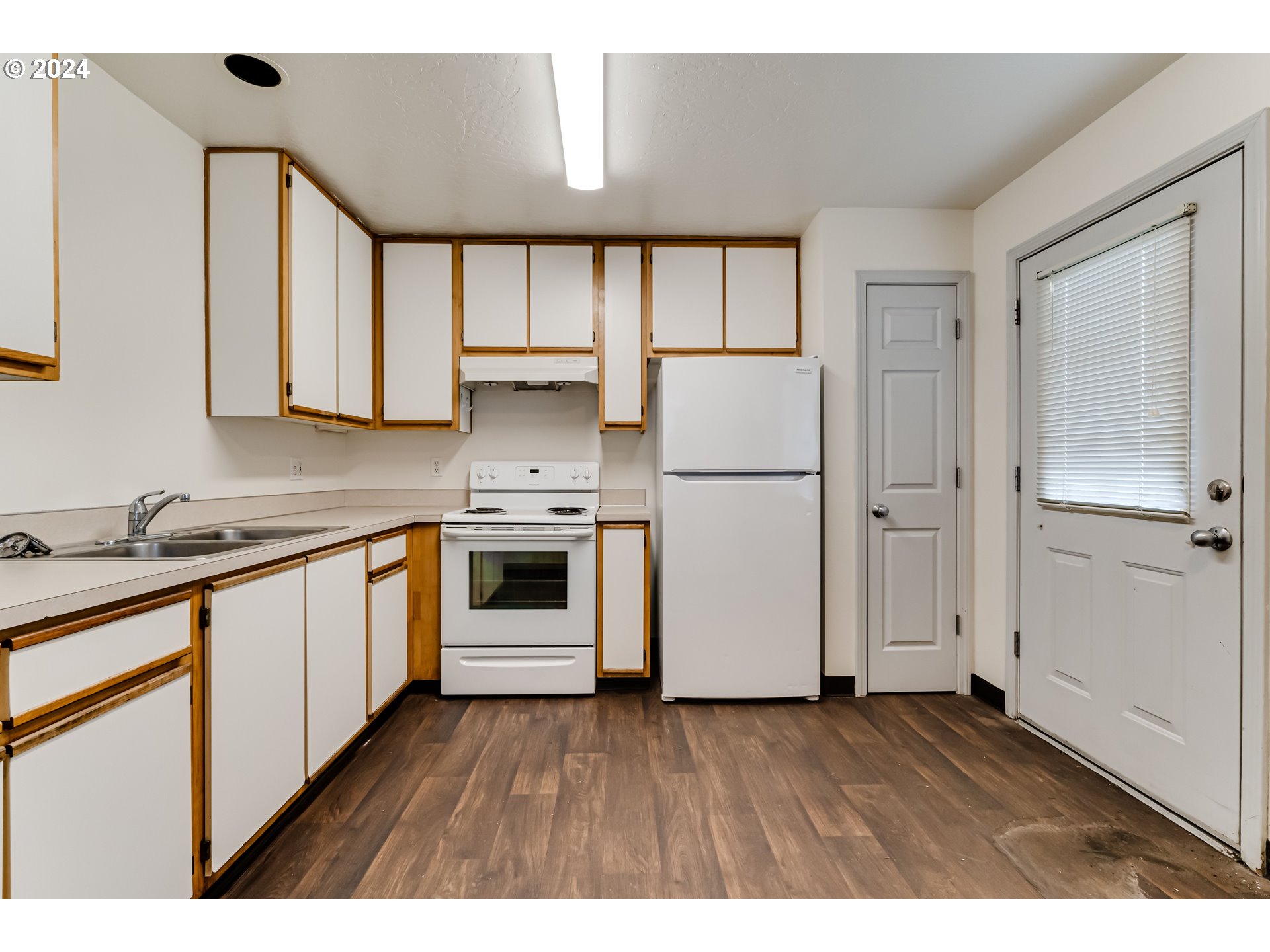 249 South 41st Place Springfield, OR 97478 - Photo 7 of 17 a kitchen with stainless steel appliances a refrigerator sink and cabinets