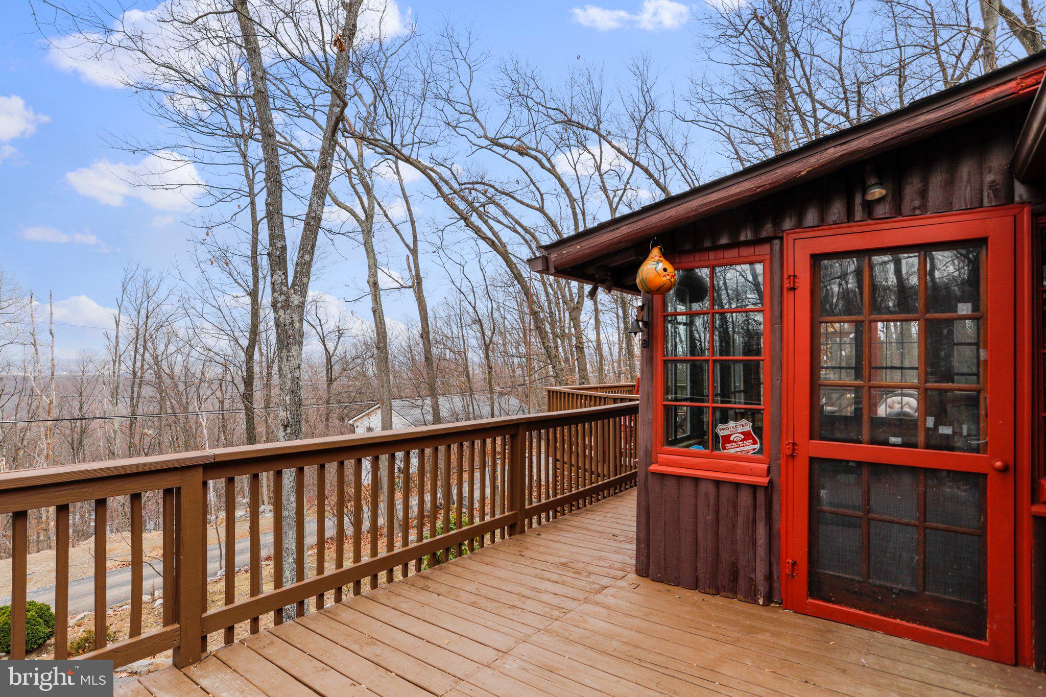 412 Valley View Road Harpers Ferry, WV 25425 - Photo 6 of 39 a balcony with wooden floor and outdoor seating
