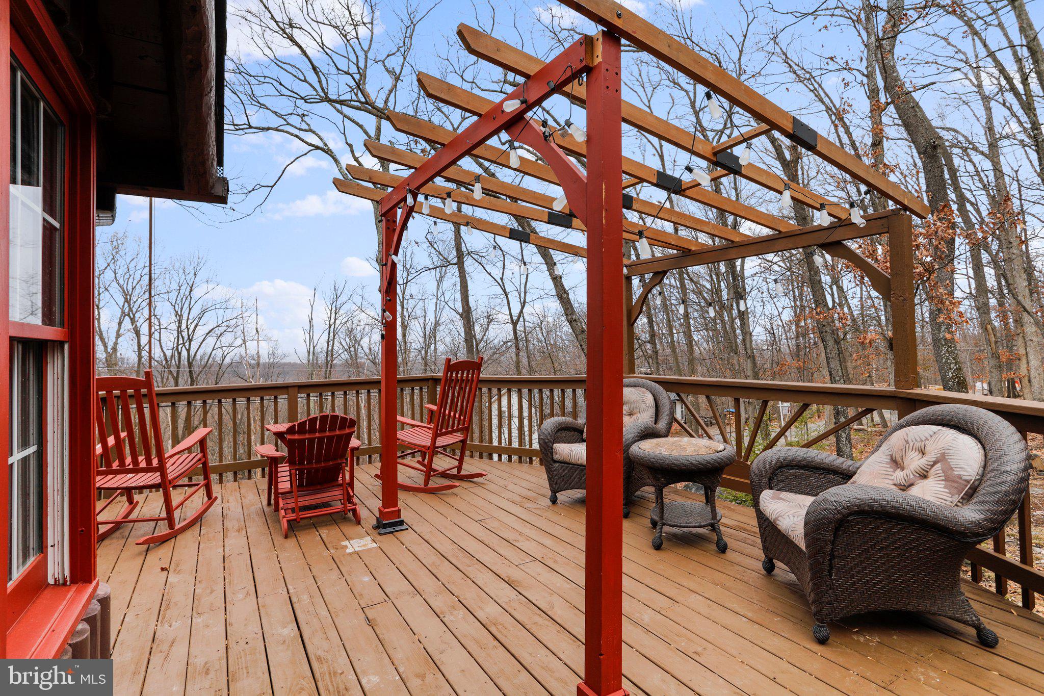 412 Valley View Road Harpers Ferry, WV 25425 - Photo 8 of 39 a balcony with wooden floor table and chairs