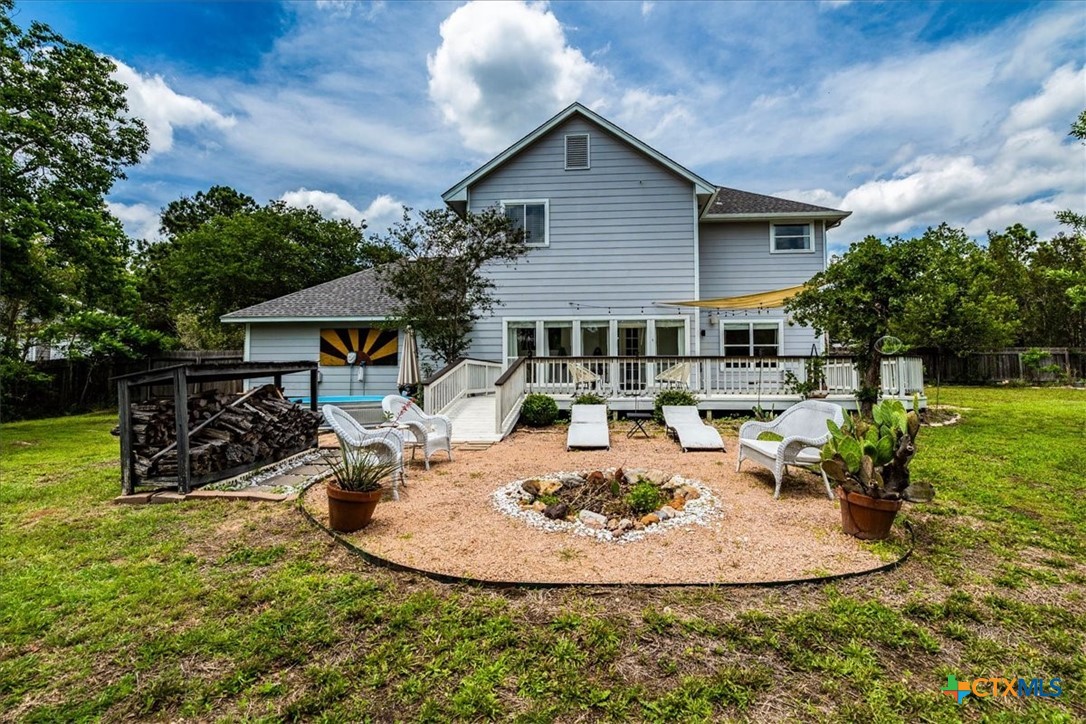 171 Pin Oak Crossing Elgin, TX 78621 - Photo 32 of 38 a view of a house with backyard porch and sitting area