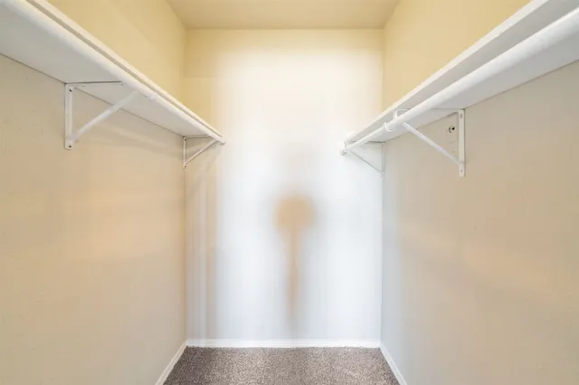 a view of a bathroom from a corridor