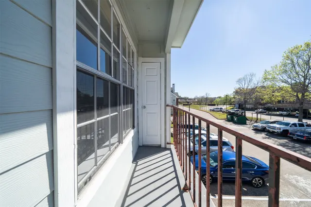 a view of balcony with furniture
