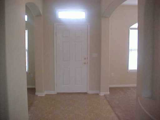 5809 Corsica Road Corpus Christi, TX 78414 - Photo 7 of 10 a view of an empty room and a window