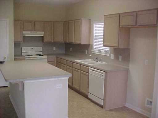 5809 Corsica Road Corpus Christi, TX 78414 - Photo 9 of 10 a kitchen with a sink stove and cabinets