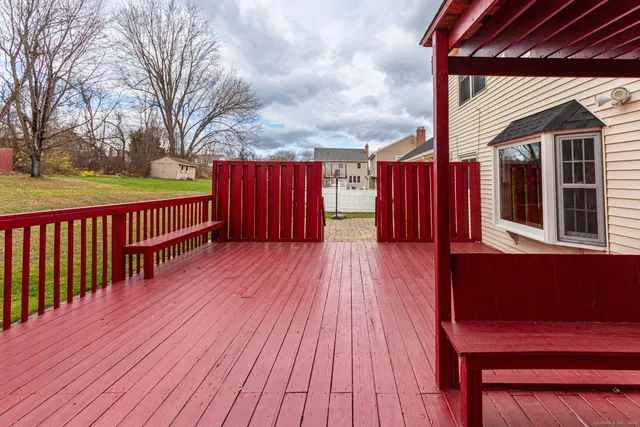 with a white wall with a white refrigerator and a white picture